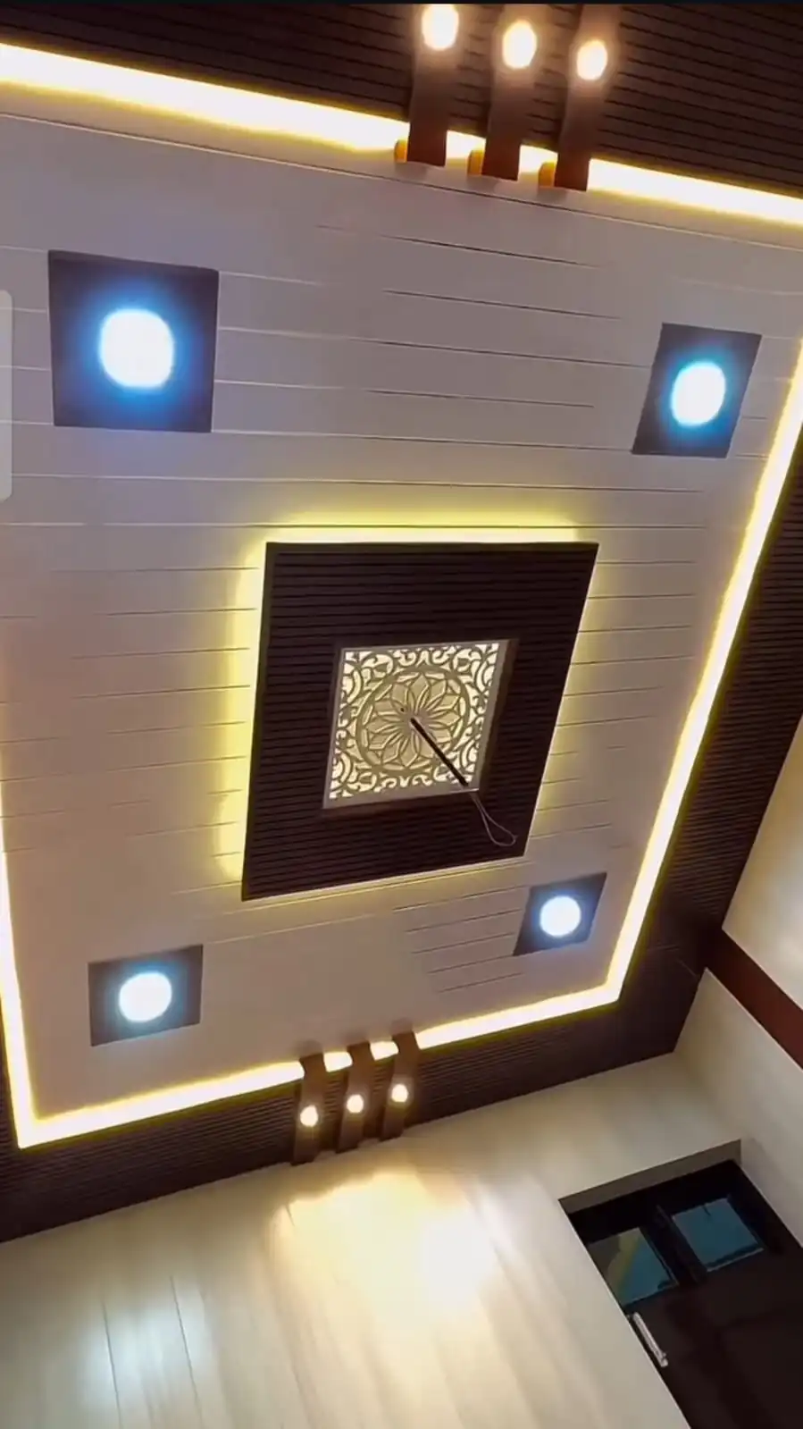 Wooden finish false ceiling with lighting in Lucknow